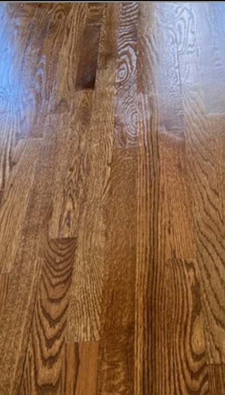 Close-up of an oak floor after sanding and a warm brown stain by The Hardwood Guys, serving Fairfield, CT